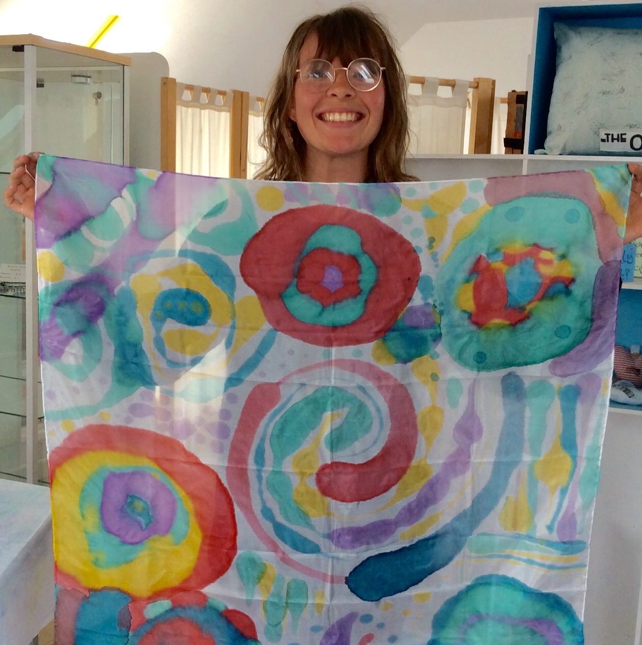 Smiling woman with her very colourful scarf